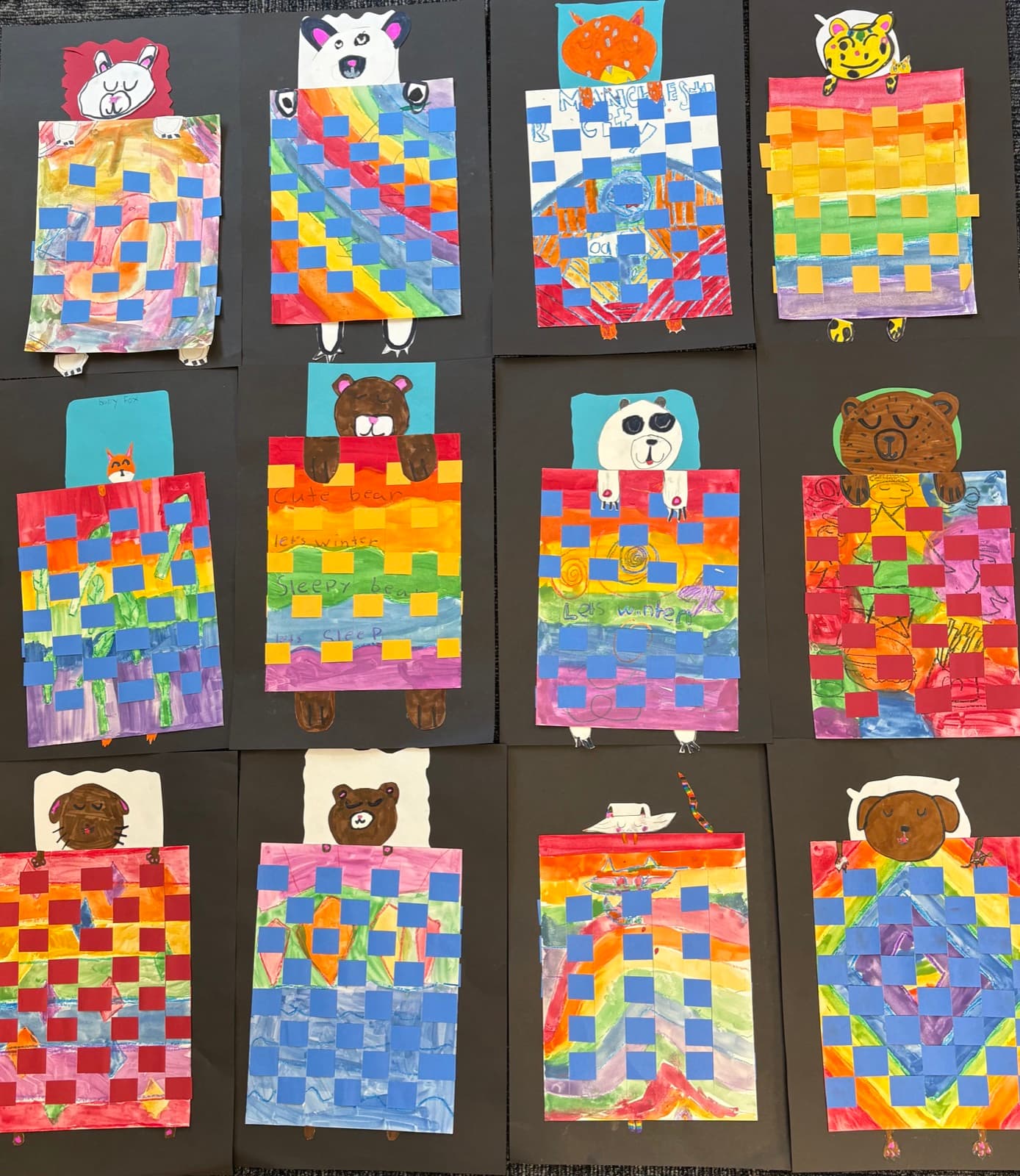 Second grade woven paper animals tucked under cozy blankets